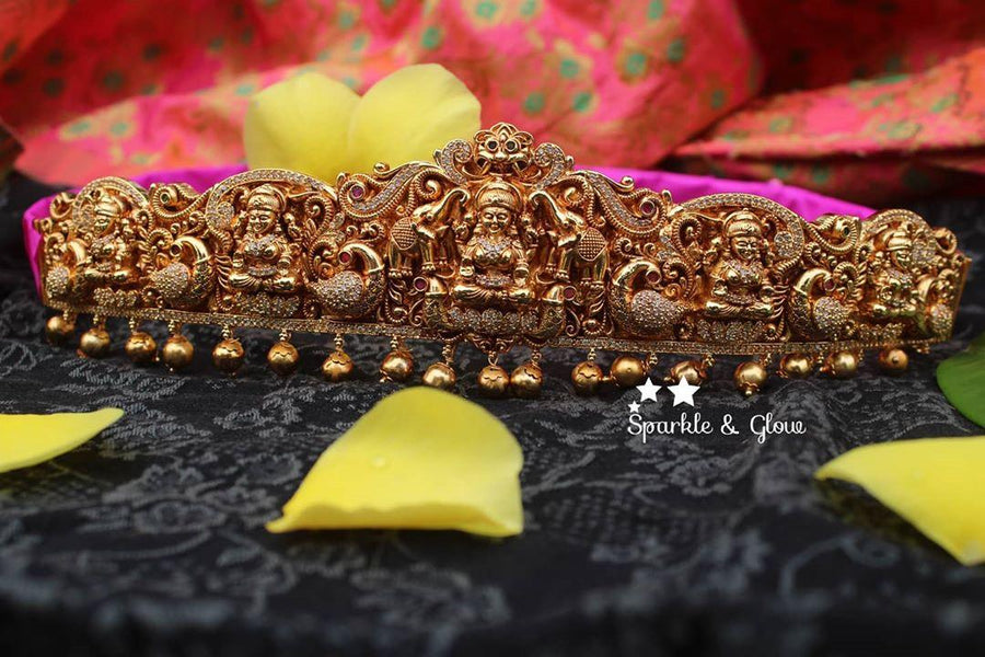 Gold alike polished carved intricately with Lakshmi , peacock and elephant hip belt - Sparkle and Glow