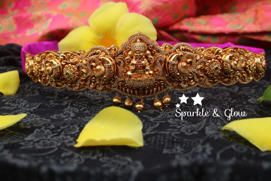Gold alike polished carved intricately with Lakshmi , peacock design hipbelt