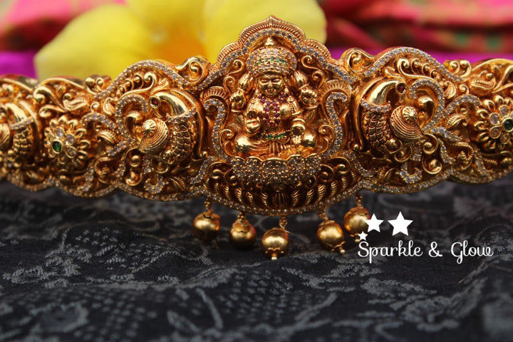 Gold alike polished carved intricately with Lakshmi , peacock design hipbelt