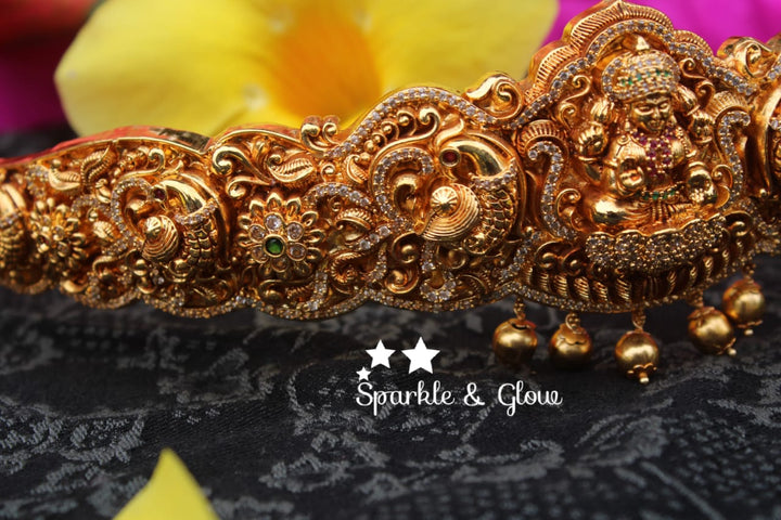Gold alike polished carved intricately with Lakshmi , peacock design hipbelt