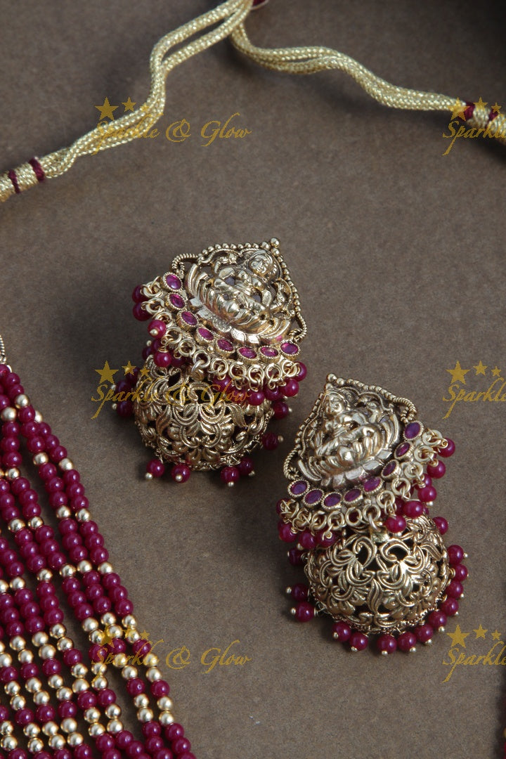 Gold alike lakshmi carved pendent multilayered pink beads necklace