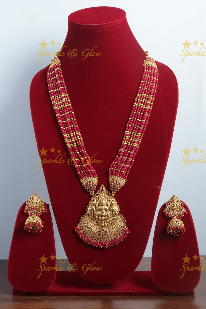 Gold alike lakshmi carved pendent multilayered pink beads necklace