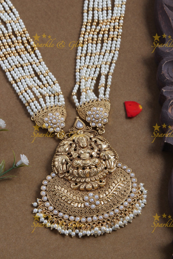 Gold alike lakshmi carved pendent multilayered white beads necklace