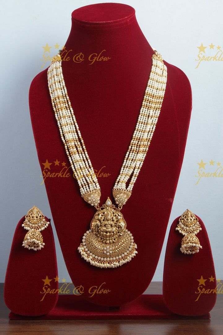 Gold alike lakshmi carved pendent multilayered white beads necklace