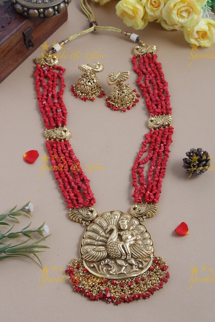 Intricately carved Kartikeyan pendent light coral beads haram