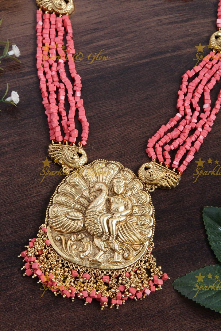 Intricately carved Kartikeyan pendent light coral beads haram