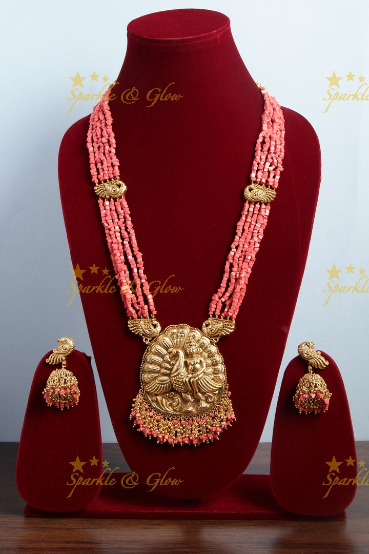 Intricately carved Kartikeyan pendent light coral beads haram