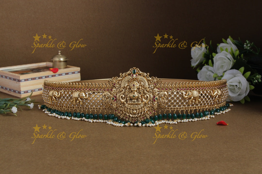 Glittering gold alike lakshmi and elephant carved hipbelt with green beads