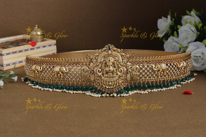 Glittering gold alike lakshmi and elephant carved hipbelt with green beads