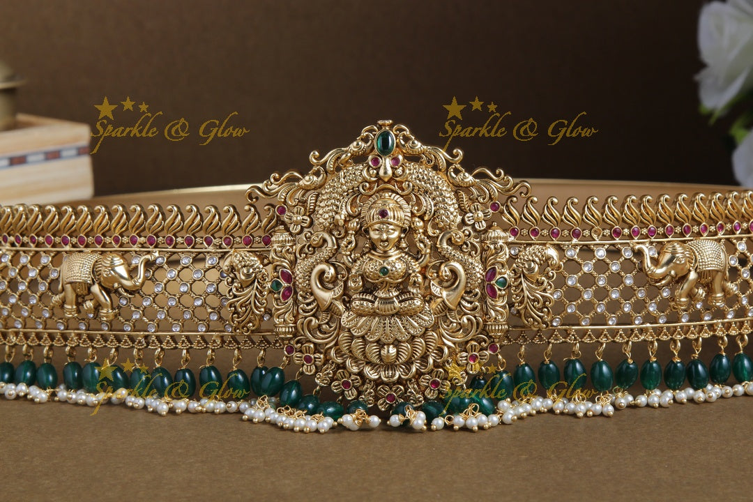 Glittering gold alike lakshmi and elephant carved hipbelt with green beads