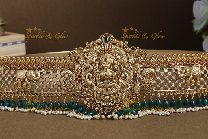 Glittering gold alike lakshmi and elephant carved hipbelt with green beads