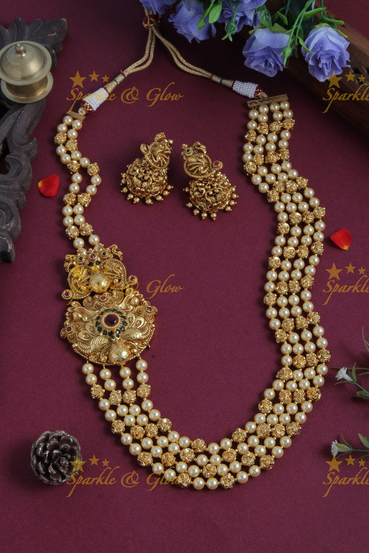 Gold Alike long gold beads and pearl necklace with intricate design side pendent