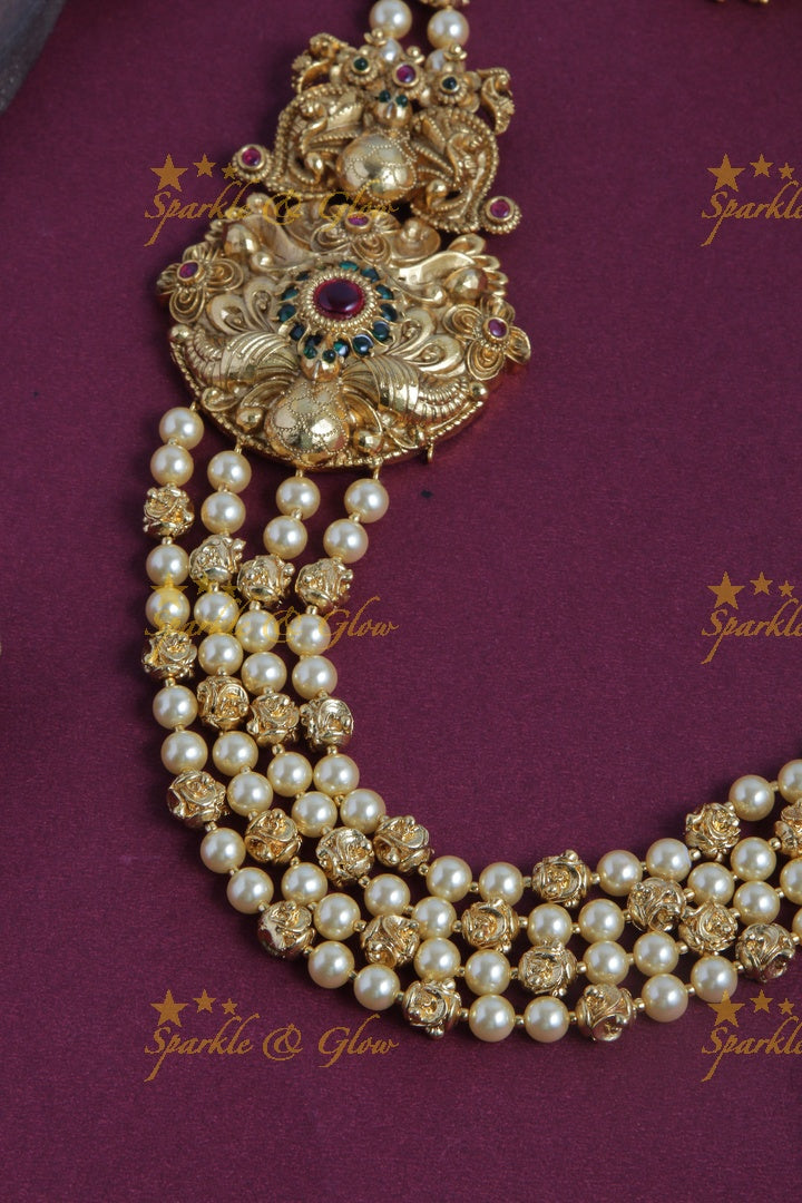 Gold Alike long gold beads and pearl necklace with intricate design side pendent