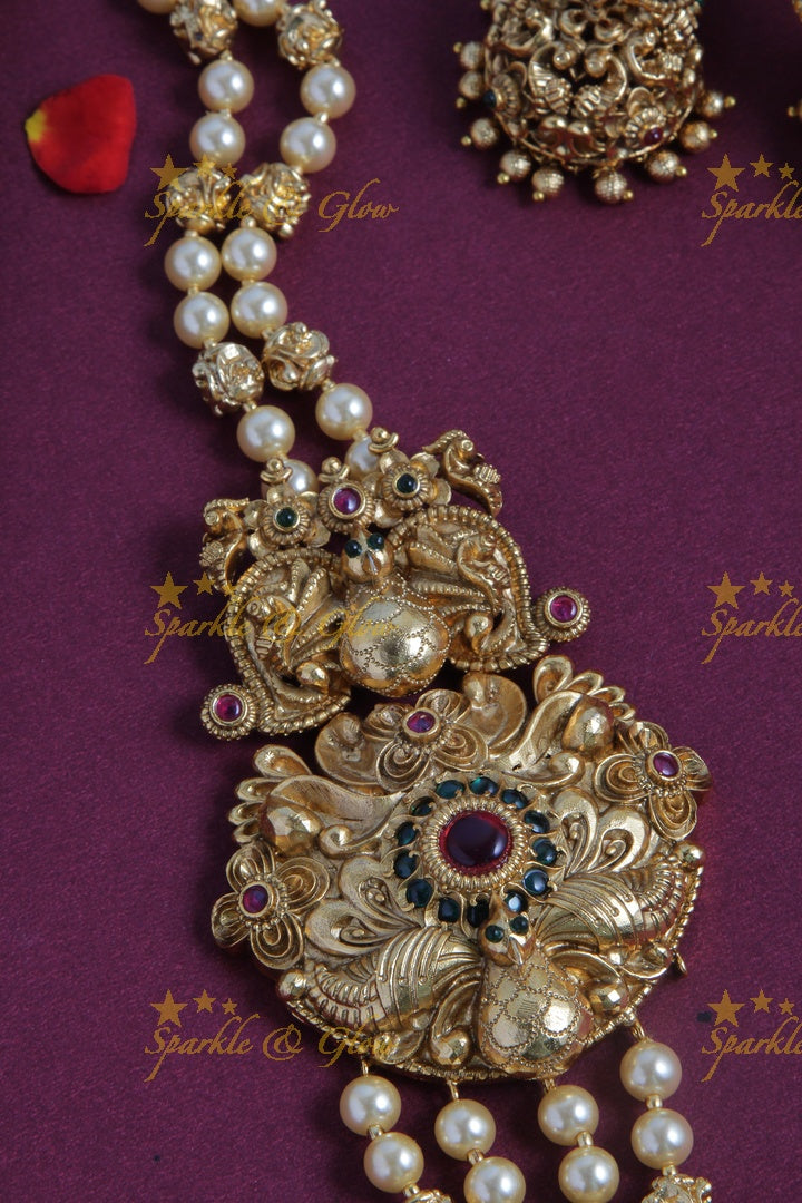Gold Alike long gold beads and pearl necklace with intricate design side pendent