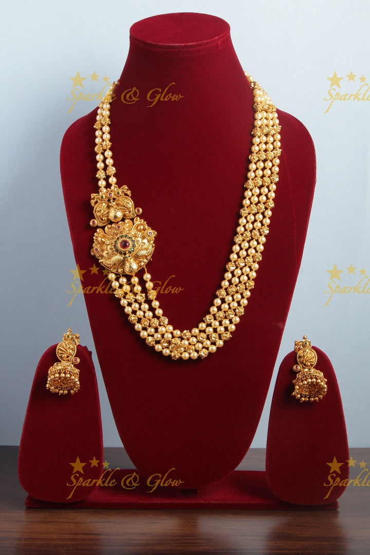 Gold Alike long gold beads and pearl necklace with intricate design side pendent