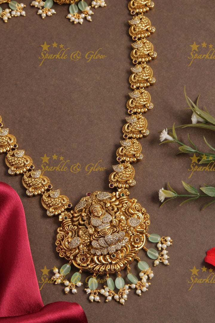 Gold alike peacock lakshmi carved elegant haram with mint green beads