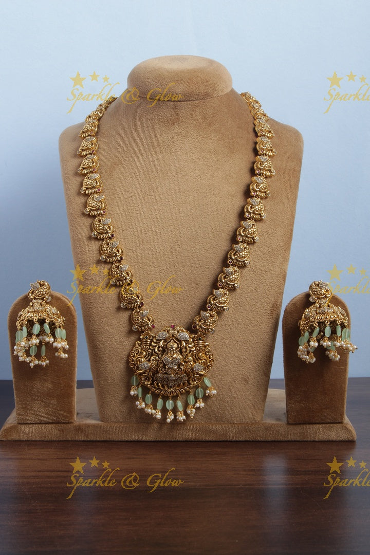Gold alike peacock lakshmi carved elegant haram with mint green beads