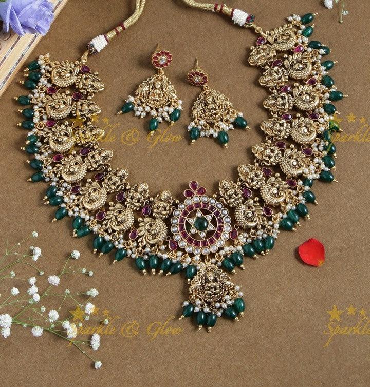 Gold alike dancing peacock and Lakshmi carved necklace - White - Gold beads - Sparkle and Glow