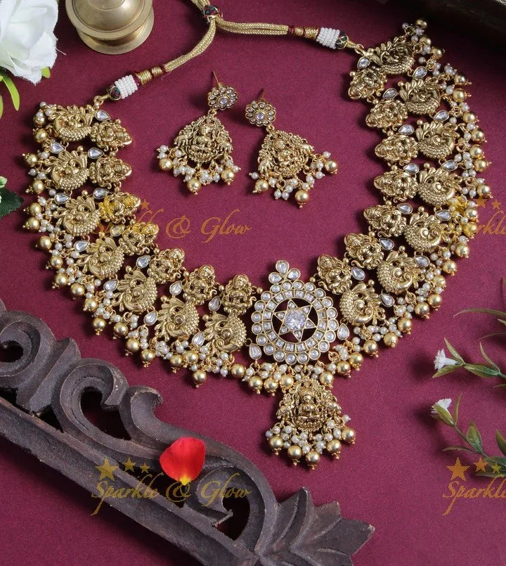 Gold alike dancing peacock and Lakshmi carved necklace - White - Gold beads - Sparkle and Glow