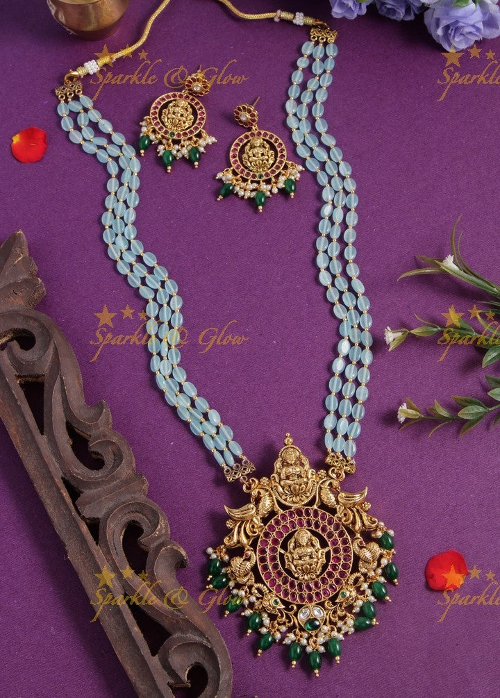 Gold alike blue bead long necklace with intricately carved lakhsmi pendent with gold beads