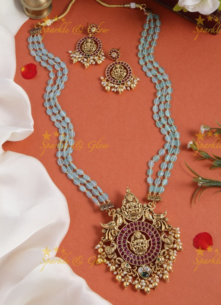 Gold alike blue bead long necklace with intricately carved lakhsmi pendent with gold beads