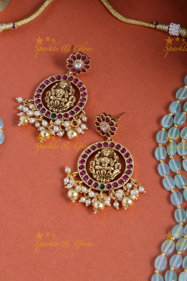 Gold alike blue bead long necklace with intricately carved lakhsmi pendent with gold beads