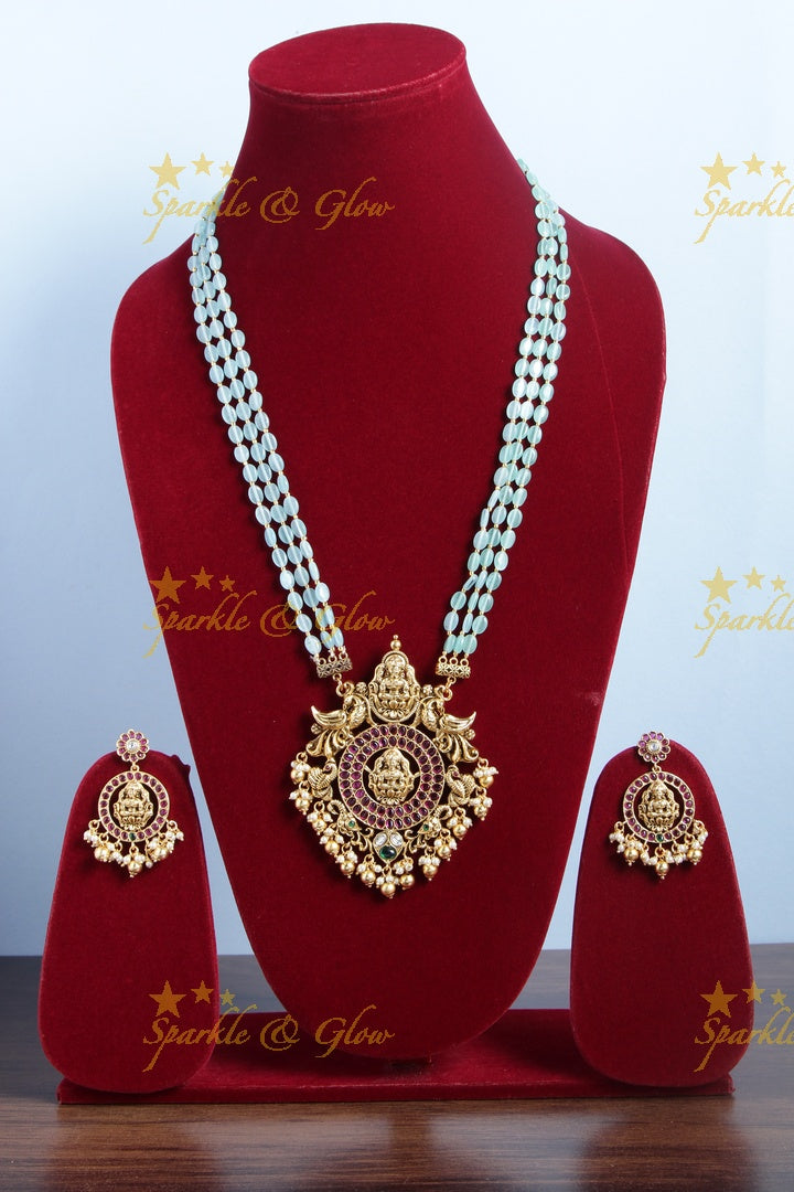Gold alike blue bead long necklace with intricately carved lakhsmi pendent with gold beads