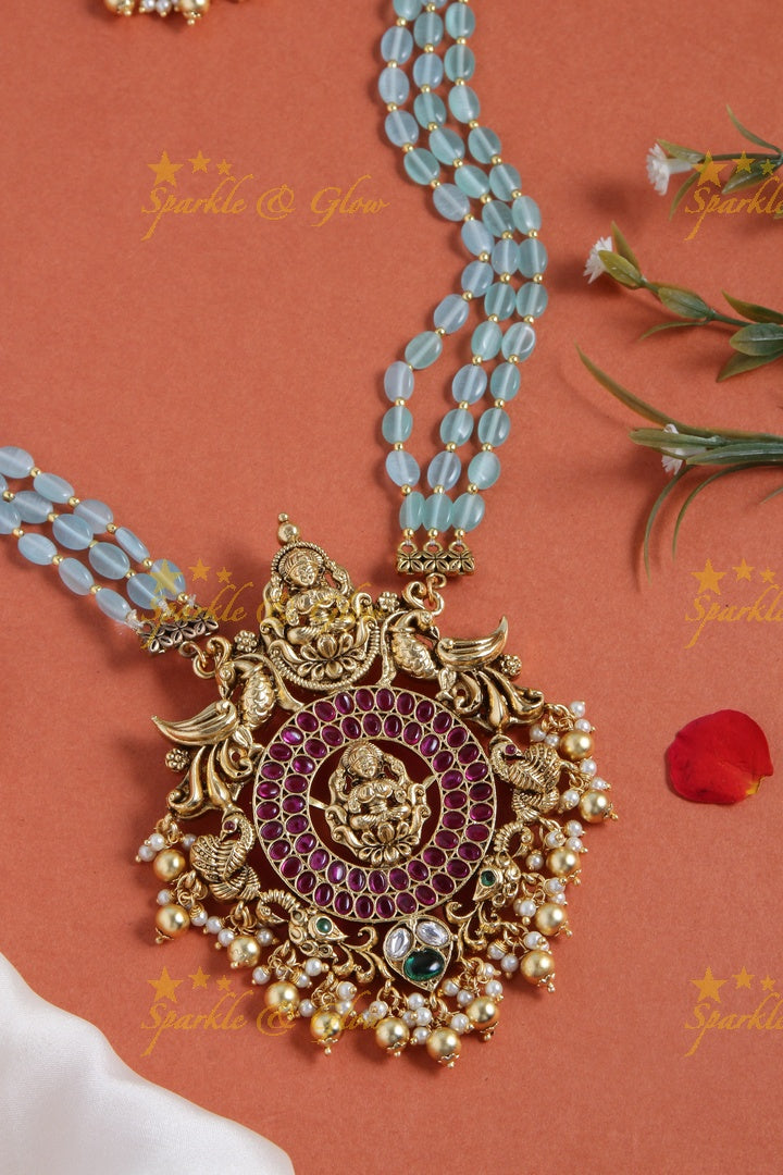 Gold alike blue bead long necklace with intricately carved lakhsmi pendent with gold beads