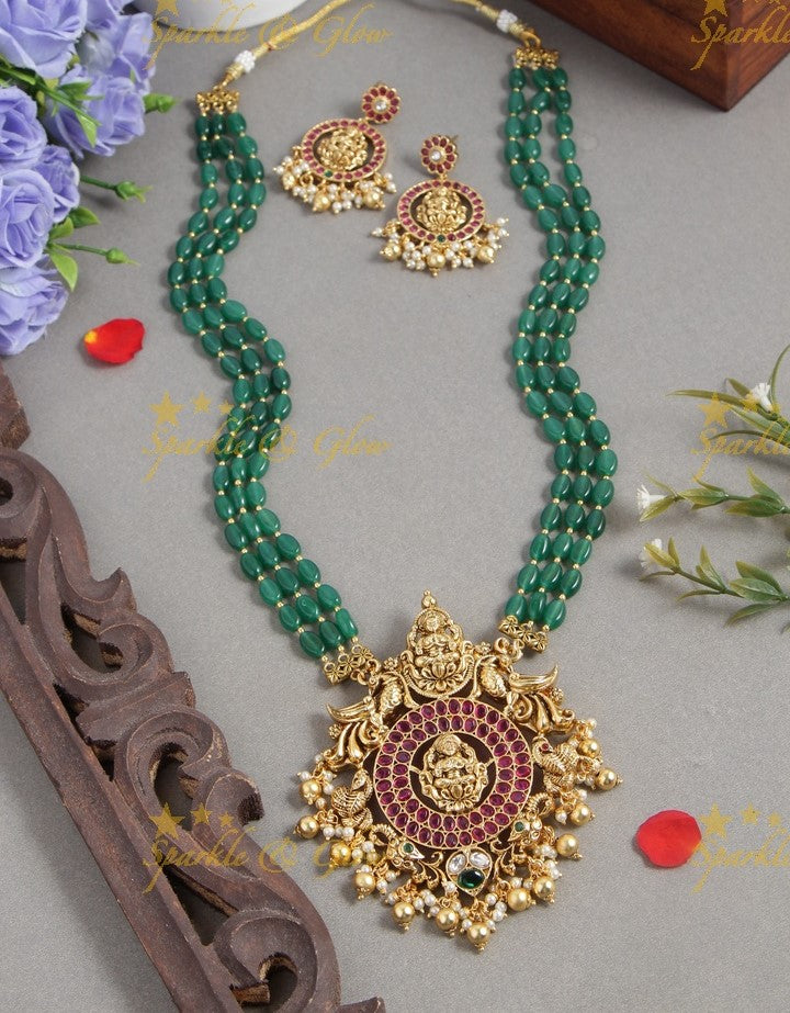 Gold alike blue bead long necklace with intricately carved lakhsmi pendent with gold beads