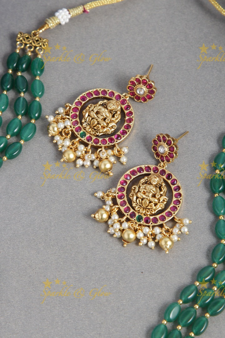 Gold alike green green bead long necklace with intricately carved lakhsmi pendent with gold beads