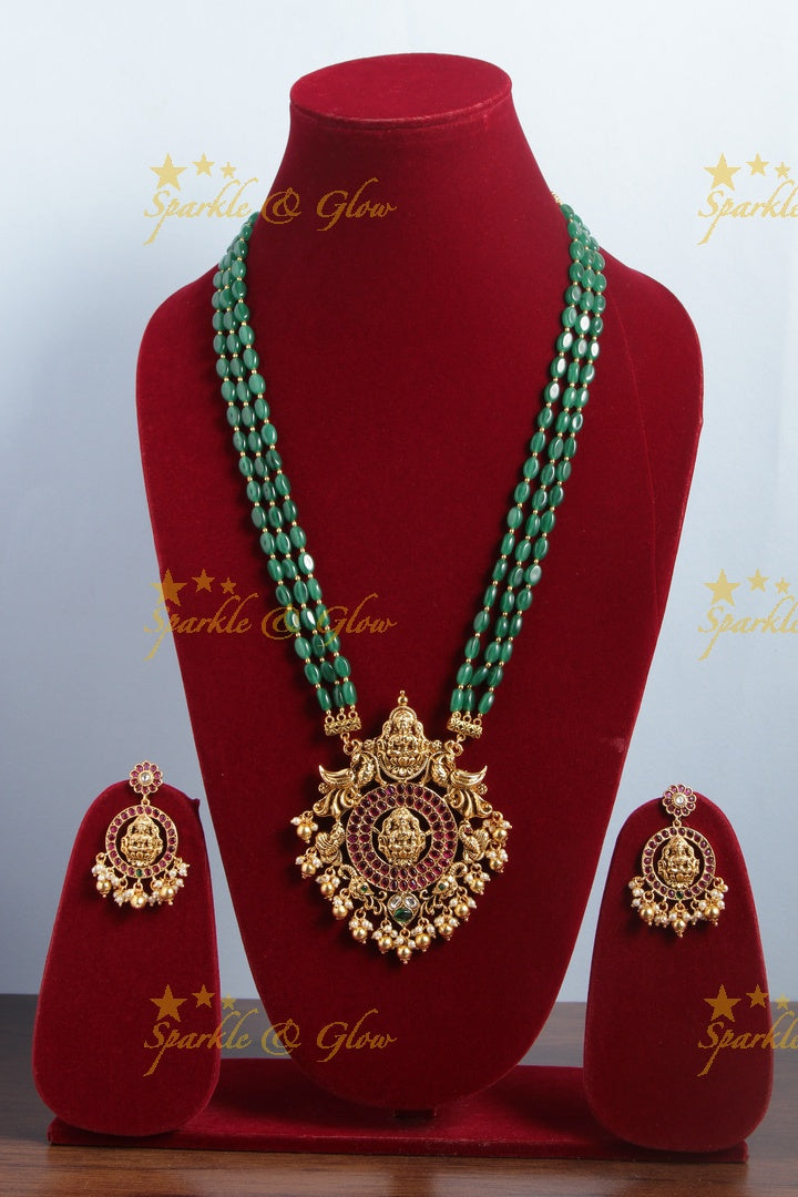 Gold alike green green bead long necklace with intricately carved lakhsmi pendent with gold beads