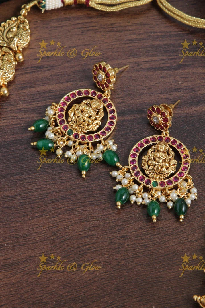 Intricately carved two layer peacock lakshmi bridal green beads long necklace - Sparkle and Glow