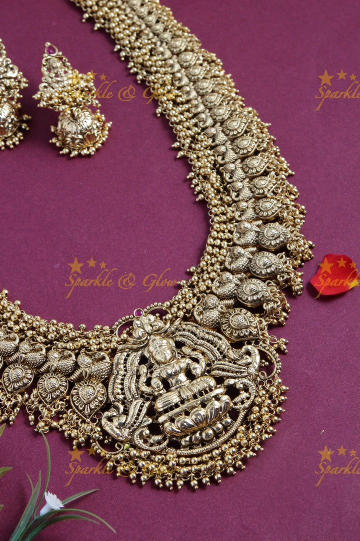 Gold alike exquisite Peacock Lakshmi carved mango haram with gold beads