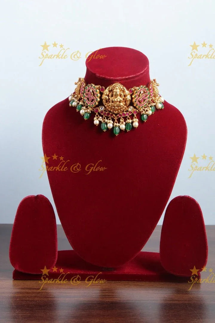 Gorgeous Jadau Choker with Lakshmi and peacock carving - Sparkle and Glow
