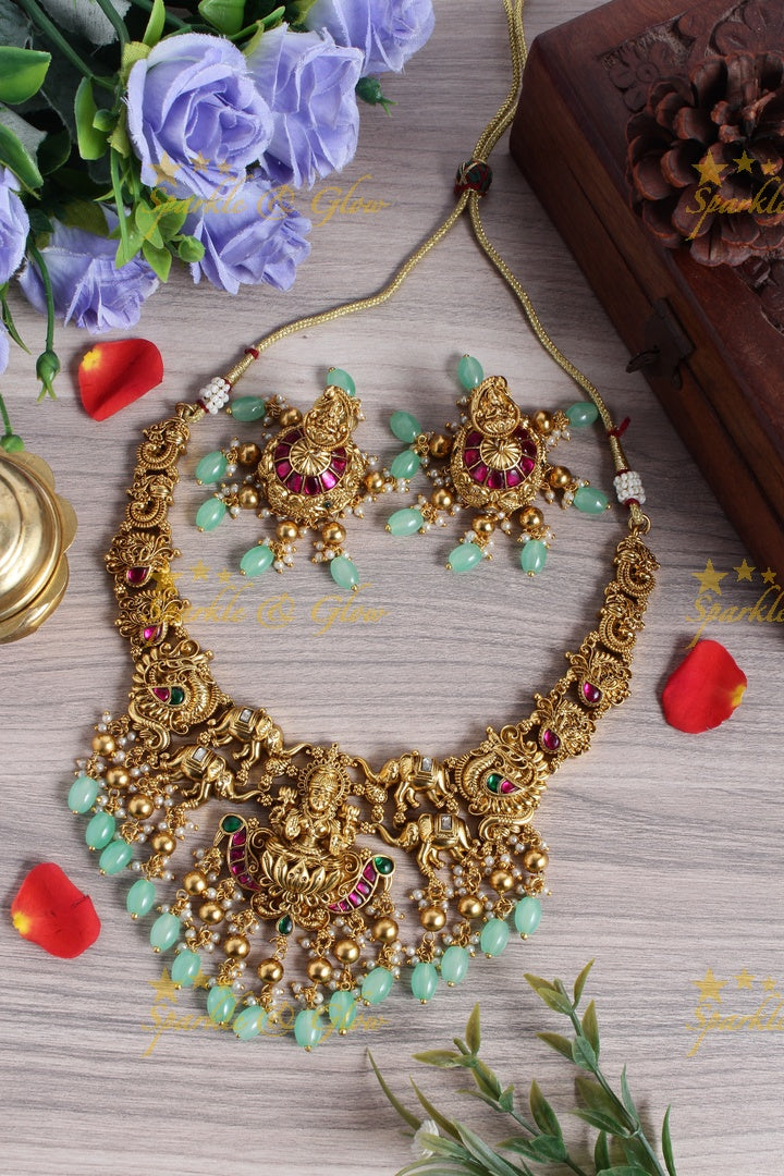 Gold alike jadau lakshmi elephant carved mint green bead necklace