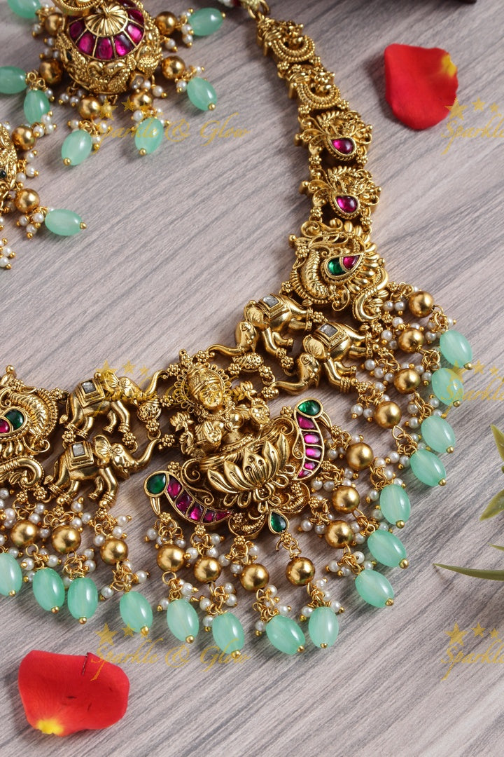 Gold alike jadau lakshmi elephant carved mint green bead necklace