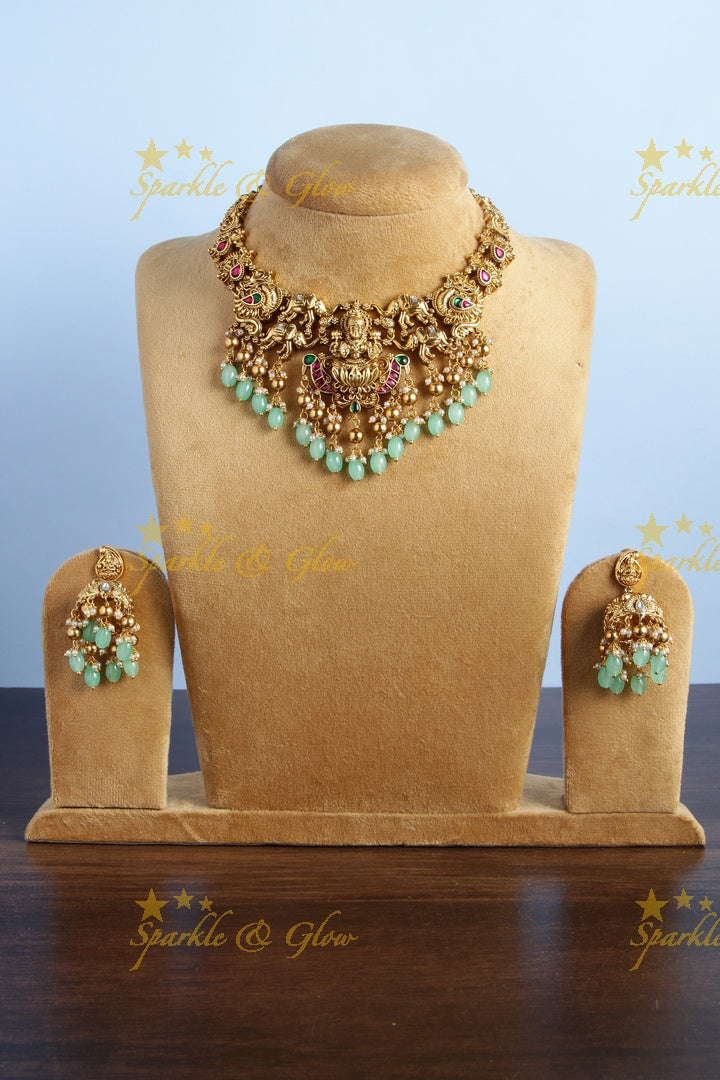 Gold alike jadau lakshmi elephant carved mint green bead necklace