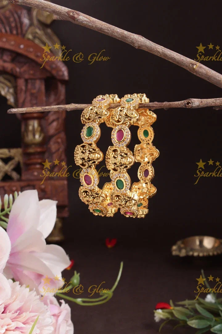 Gold alike lakshmi carved oval stone bangles - Sparkle and Glow