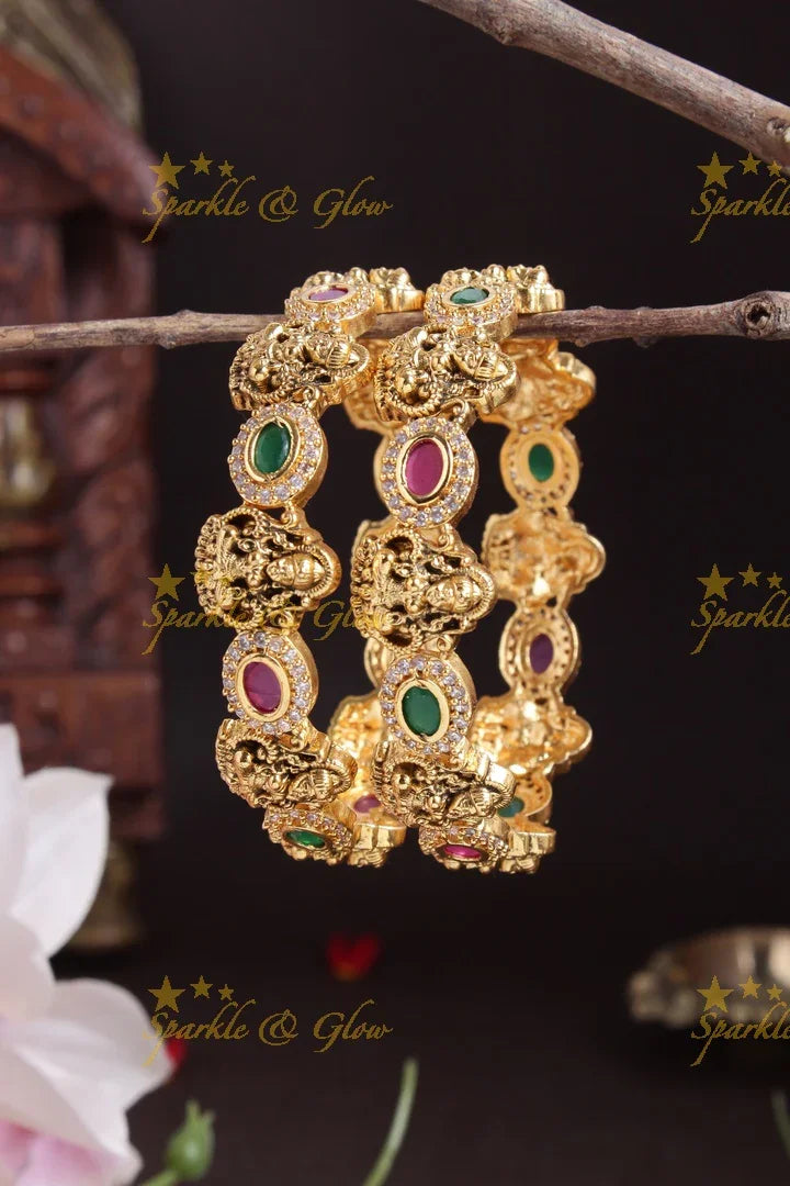 Gold alike lakshmi carved oval stone bangles - Sparkle and Glow