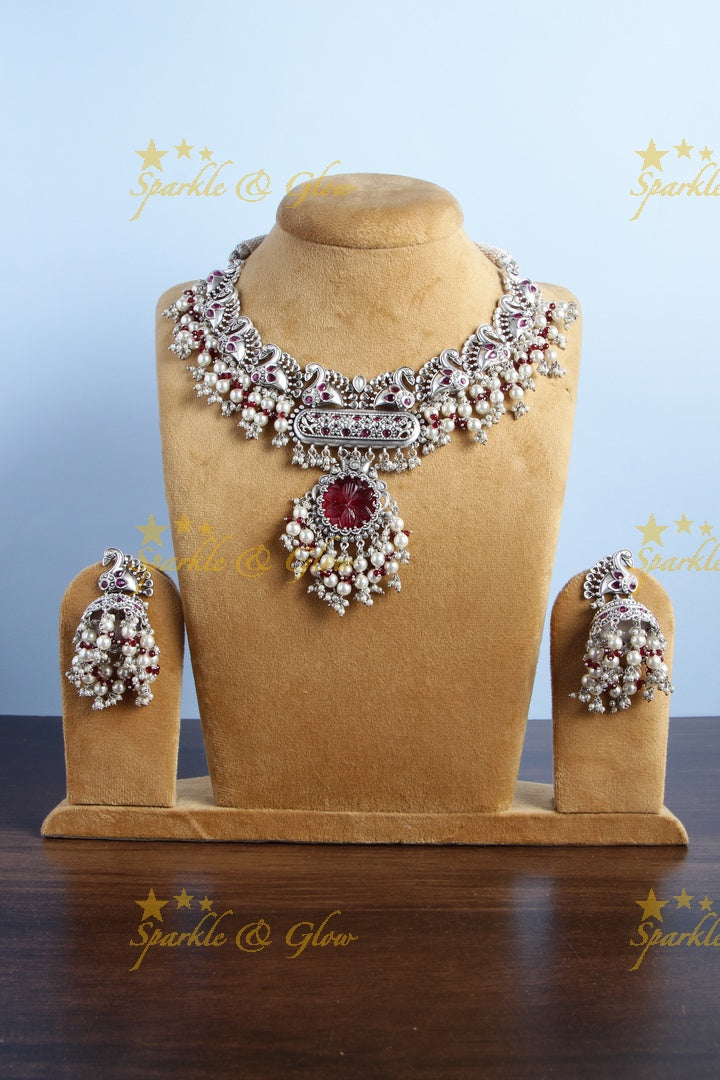 Silver finish peacock design pearl necklace