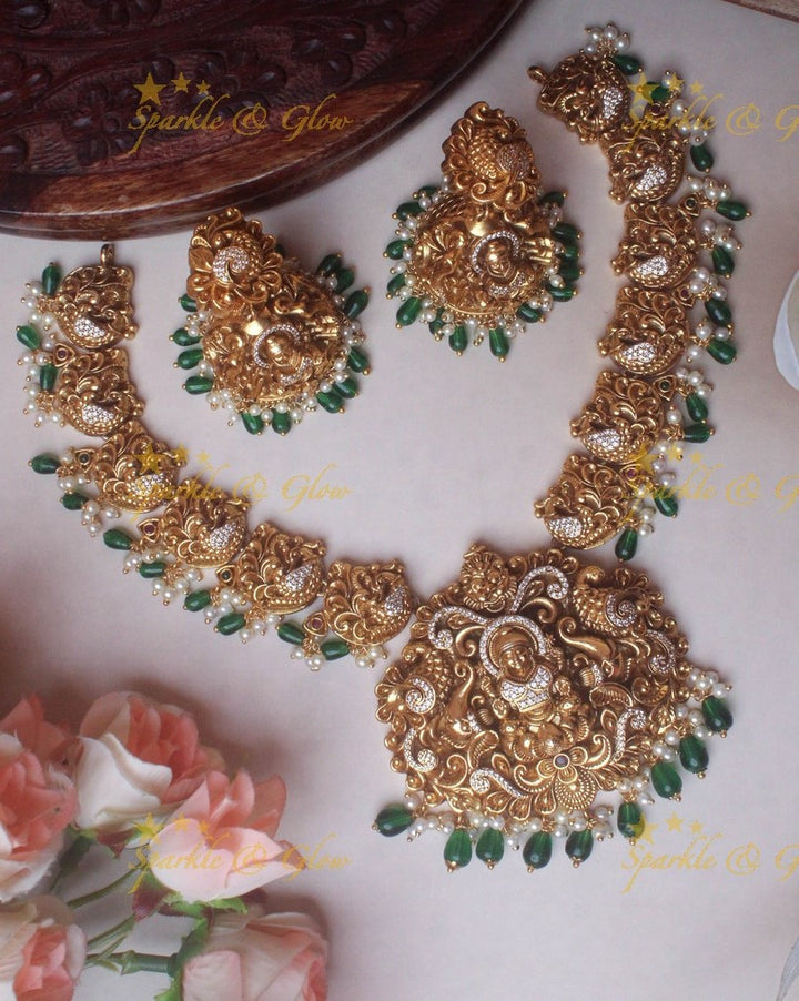 Gold alike Elegant Lakshmi Peacock necklace with green beads