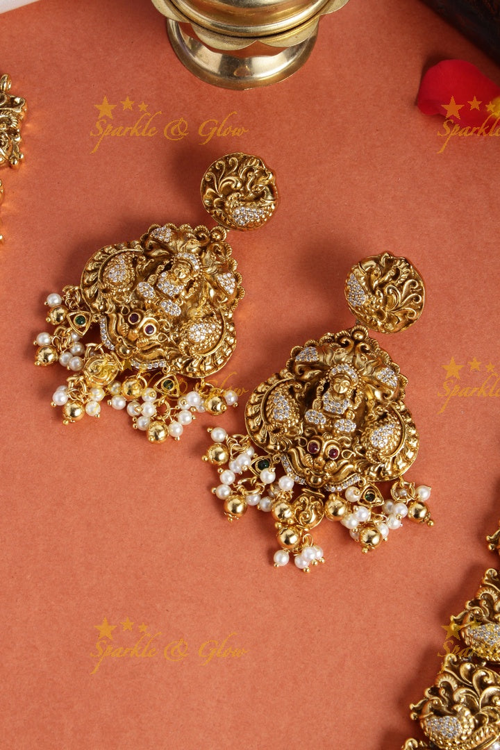 Gold alike long peacock necklace with lakshmi carved pendent