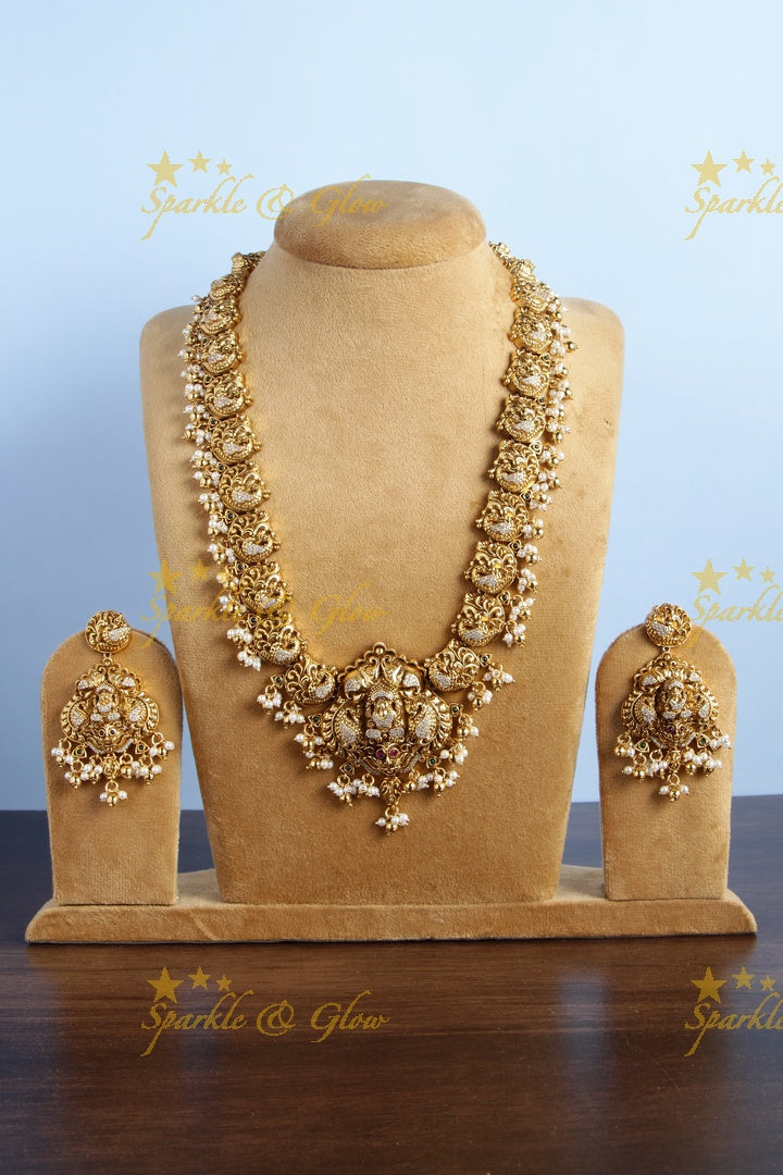 Gold alike long peacock necklace with lakshmi carved pendent