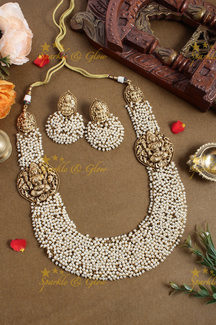 Gold alike pearl cluster statement lakshmi carved necklace