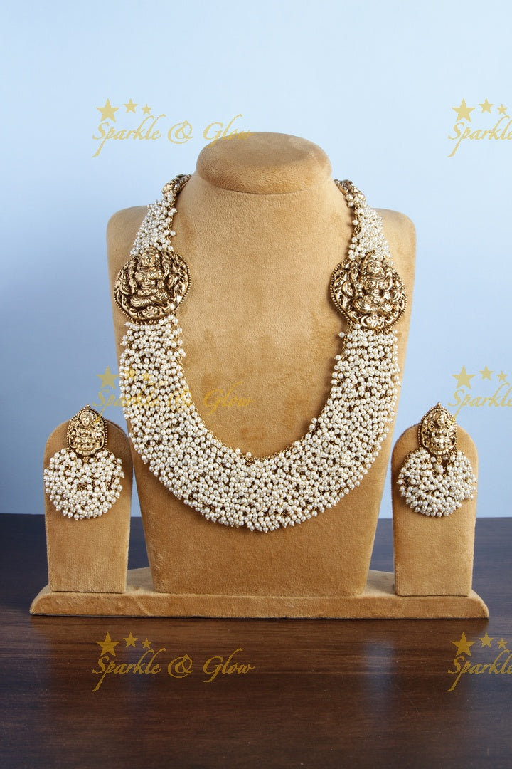 Gold alike pearl cluster statement lakshmi carved necklace