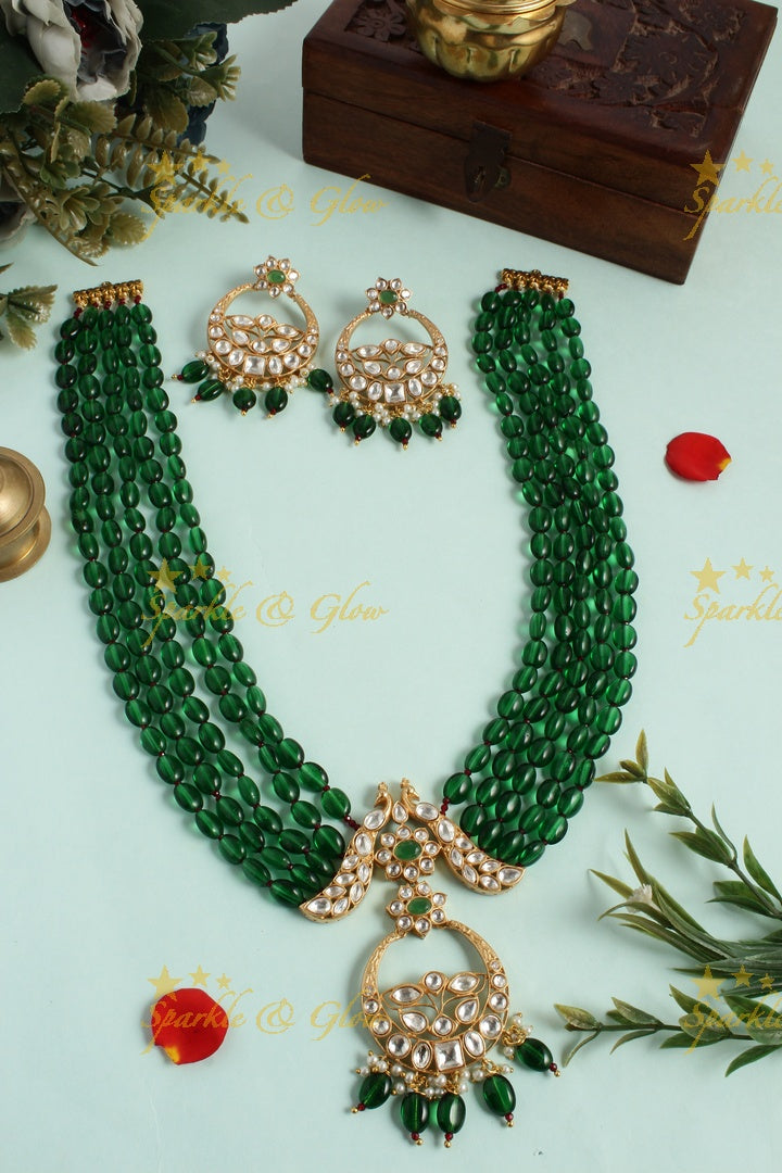 Beautiful kundan peacock necklace with half moon floral pendent - Green