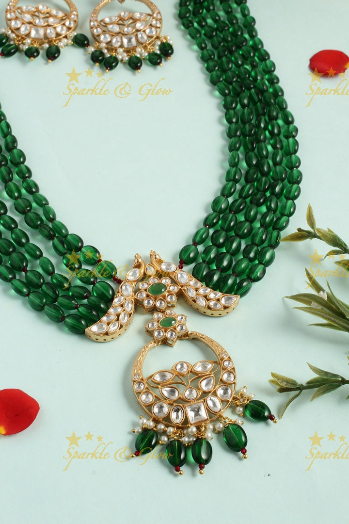 Beautiful kundan peacock necklace with half moon floral pendent - Green