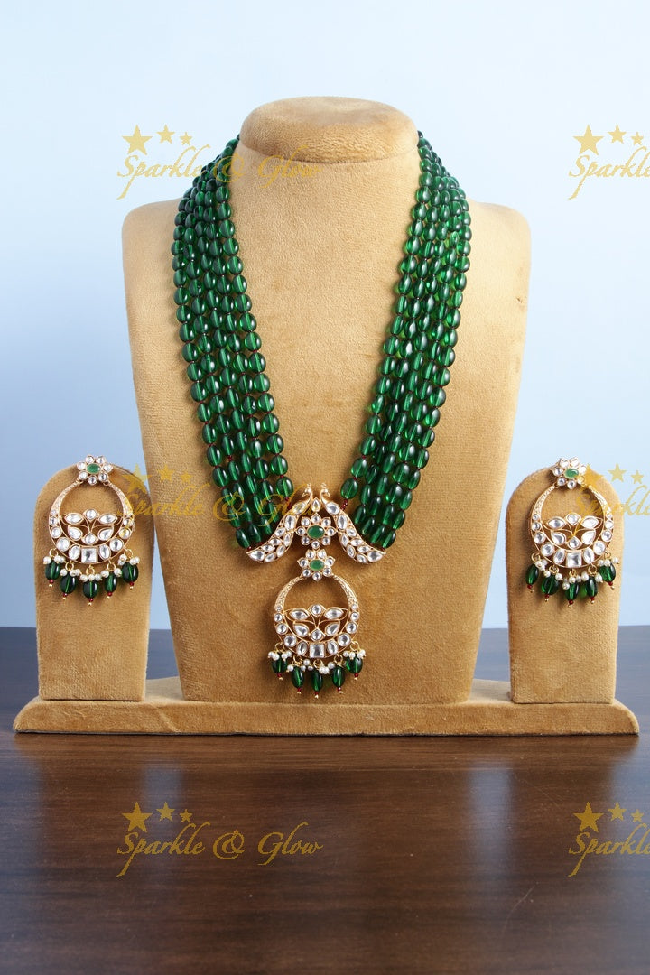 Beautiful kundan peacock necklace with half moon floral pendent - Green