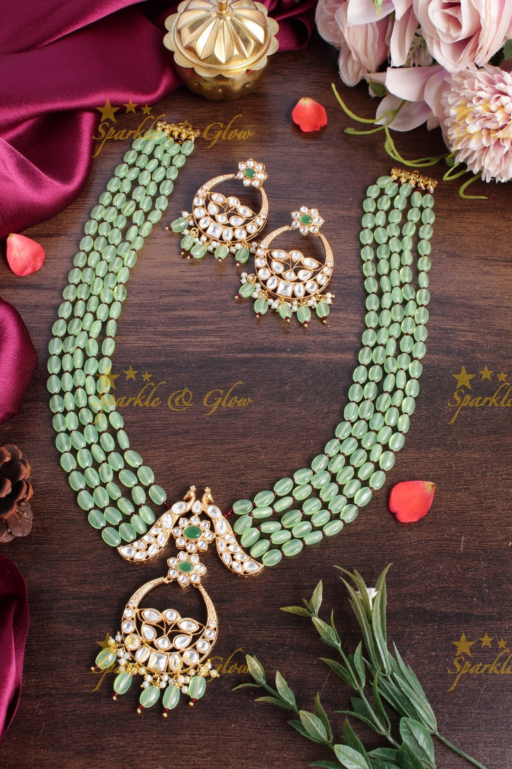 Beautiful kundan peacock necklace with half moon floral pendent - Red