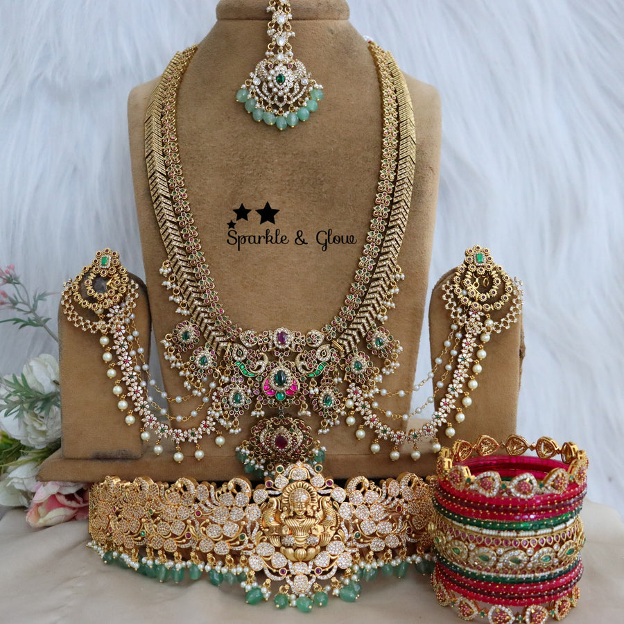 Enhance your bridal look with this beautifully crafted Temple Semi Bridal Set, inspired by traditional South Indian artistry!!
Wedding Season Sale Get 15% discount on sitewide
Get Free Gift Above 10k
Get Free Shipping above 7.5k &30k(Domestic&
International)
Get 7% discount on First Order

1.ID L-6641,H-25253,EC-23478,B-24580,24718,25821_2_4,MT-24491
2.ID L-9206,H-18186,EC-28332,B-24580,24587,25821_2_4,MT-25121
3.ID L-19955,H-18186,EC-23471,B-2945,17419,MT-29027
4.ID L-18097,H-18186,E-17099,EC-27951,B-2945,